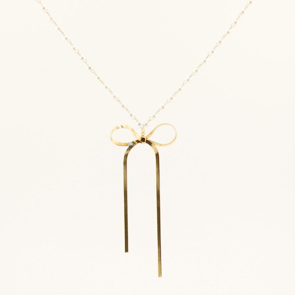 Collana in oro 18K con ciondolo a fiocco e due pendenti lunghi, catena sottile