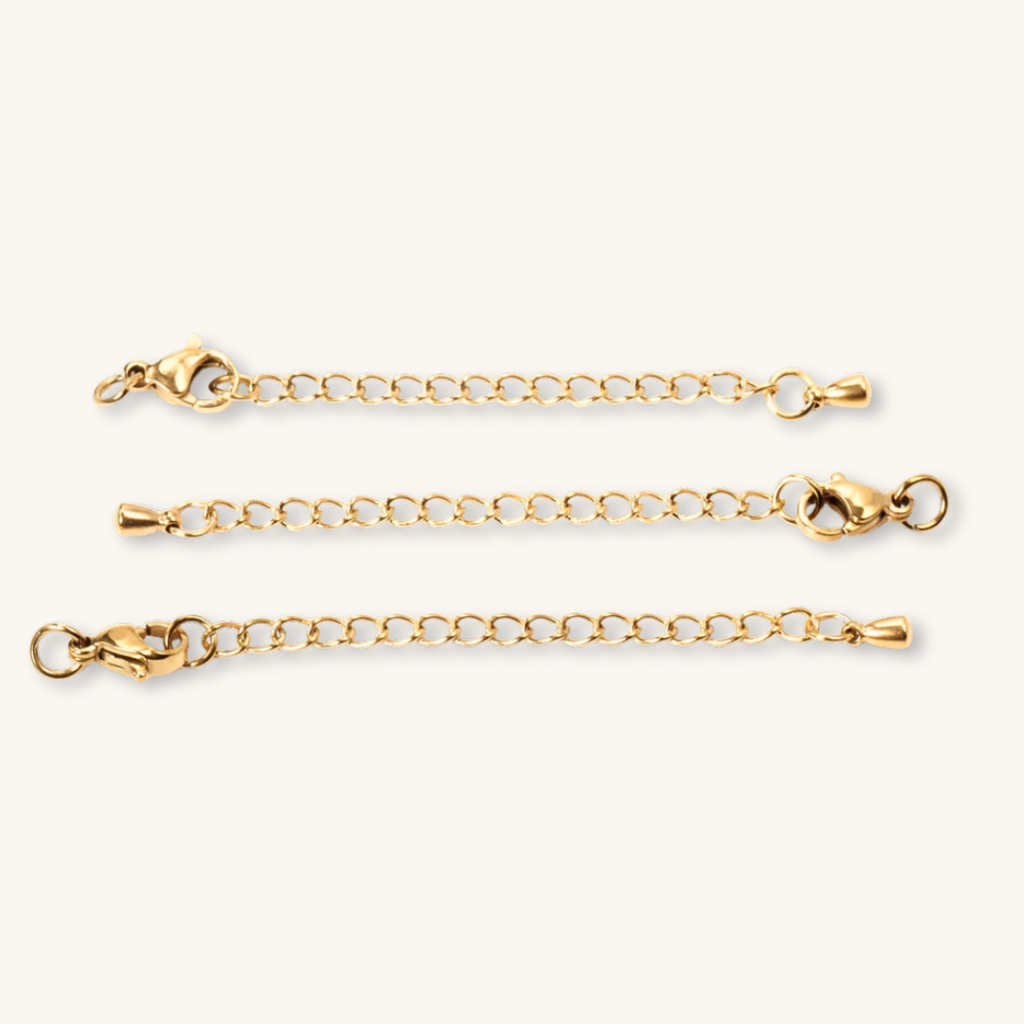 Tre prolunghe in catena oro 18K con diverse chiusure a moschettone