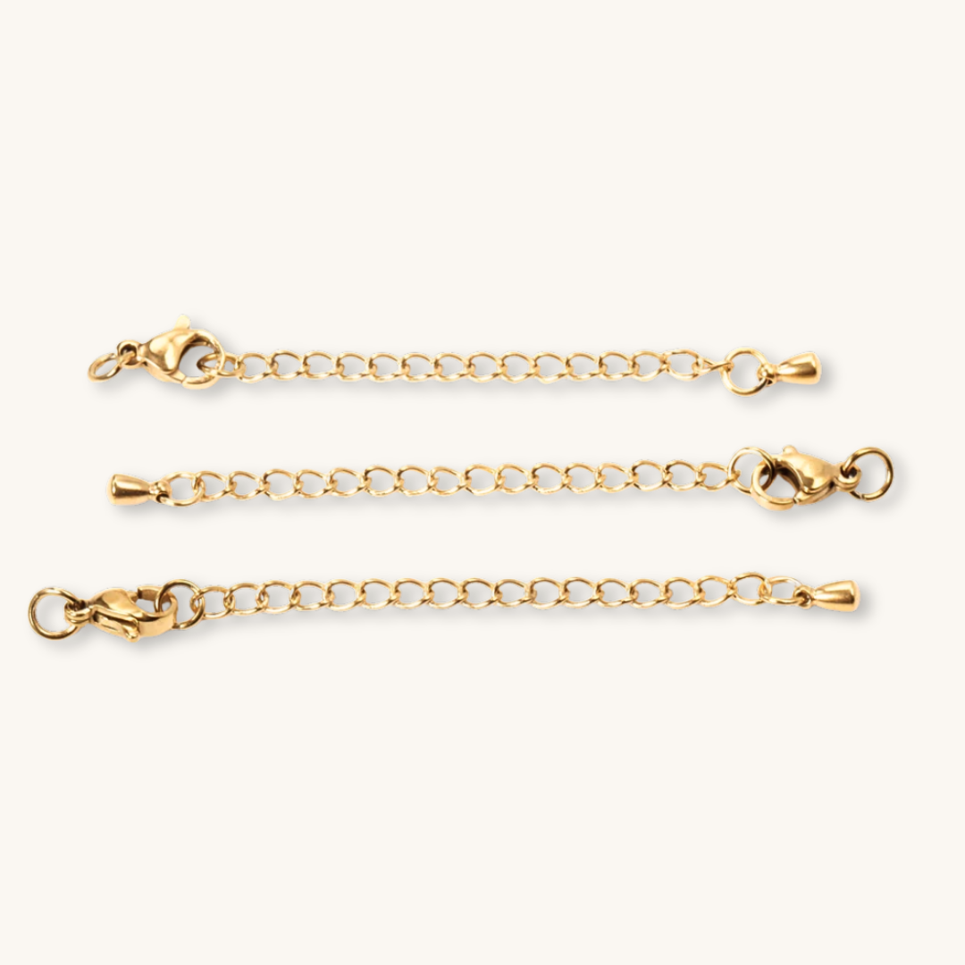 Tre prolunghe in catena oro 18K con diverse chiusure a moschettone