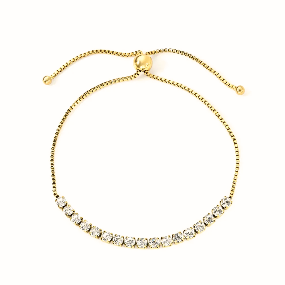 Bracciale tennis dorato in acciaio con zirconi bianchi da 3mm e chiusura regolabile a cursore.