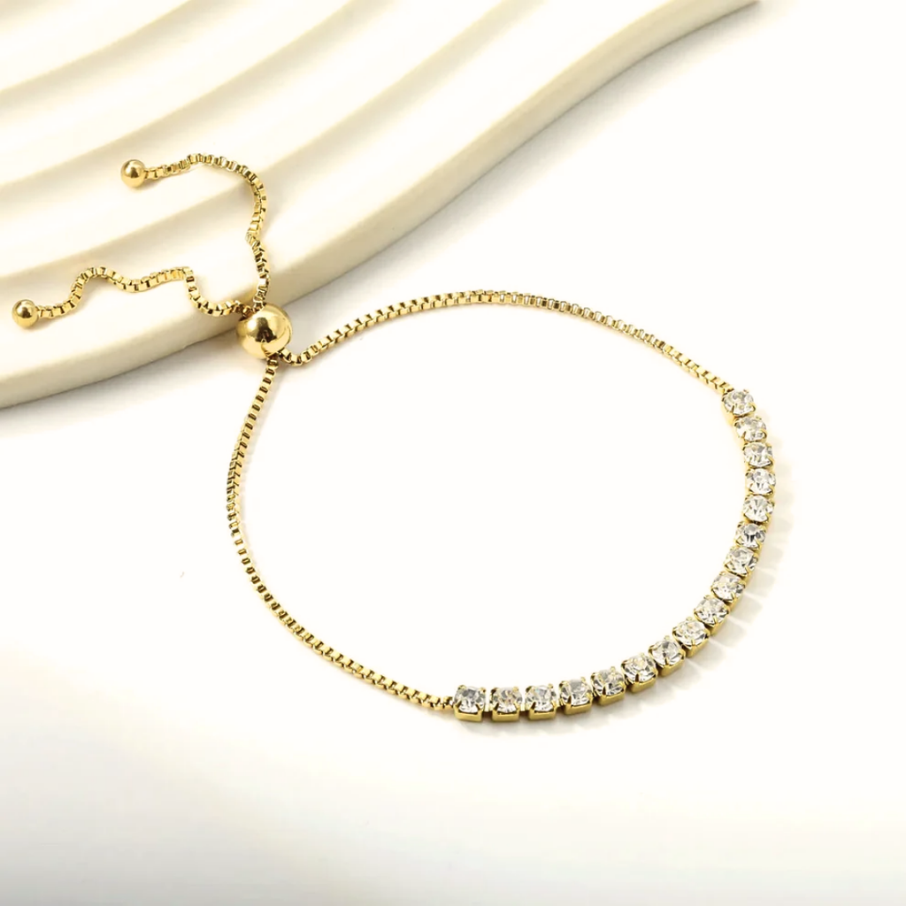 Bracciale tennis in oro giallo con zirconi trasparenti e chiusura regolabile
