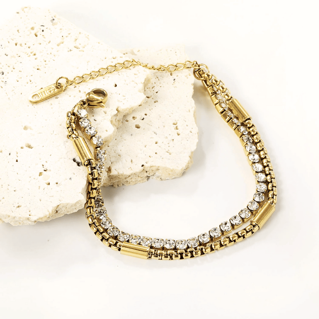 Bracciale tennis oro con zirconi su maglie a catena, chiusura laterale