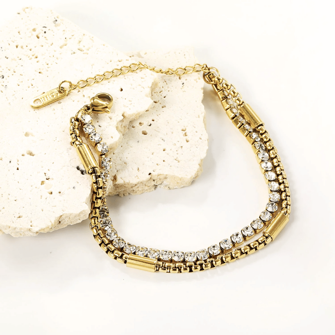 Bracciale tennis oro con zirconi su maglie a catena, chiusura laterale