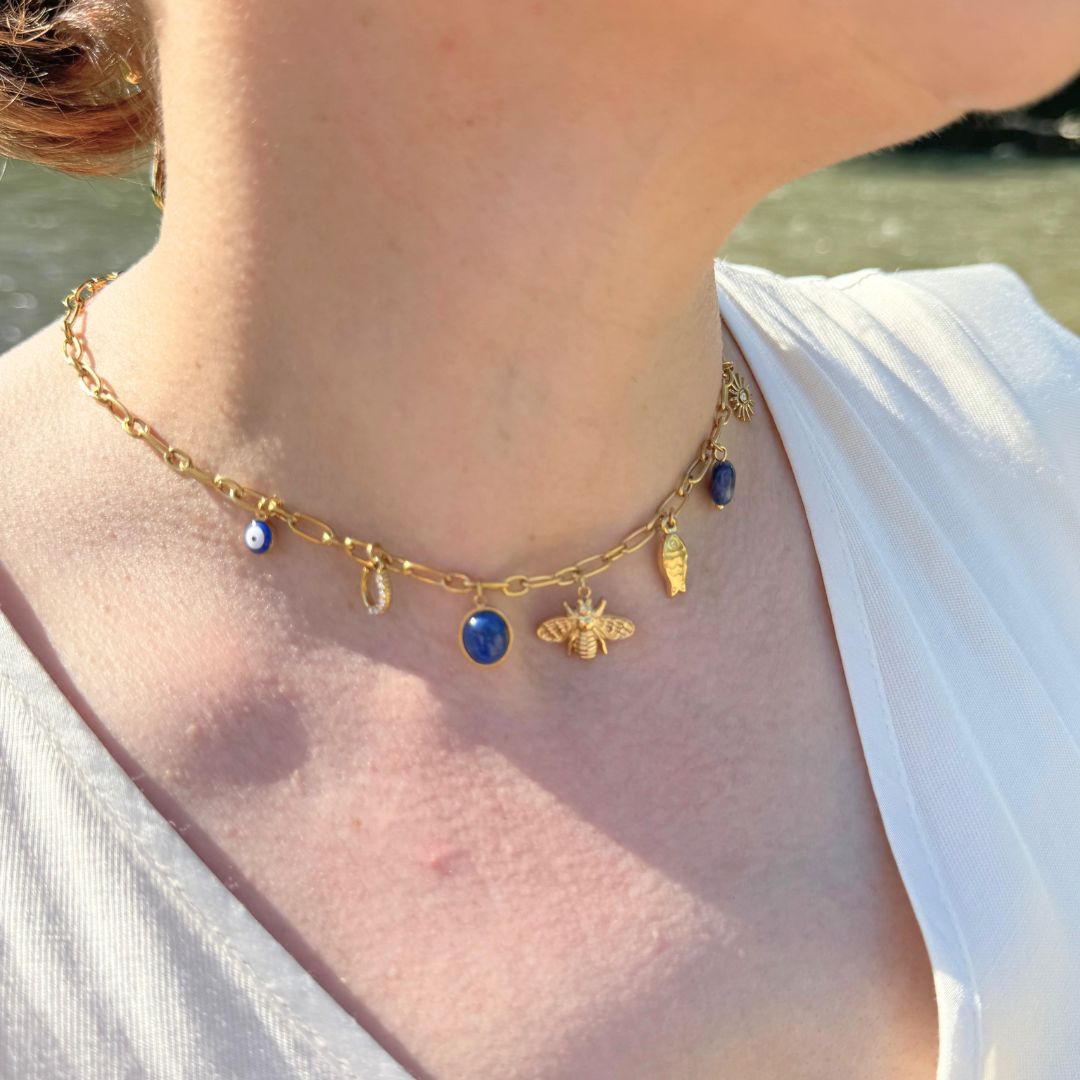 Collana portafortuna oro 18K con catena e ciondoli blu a occhio, sole e fiore