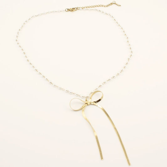 Collana romantica con pendente a fiocco in acciaio316L e Oro 18K. Elegante, waterproof e perfetta per ogni occasione.