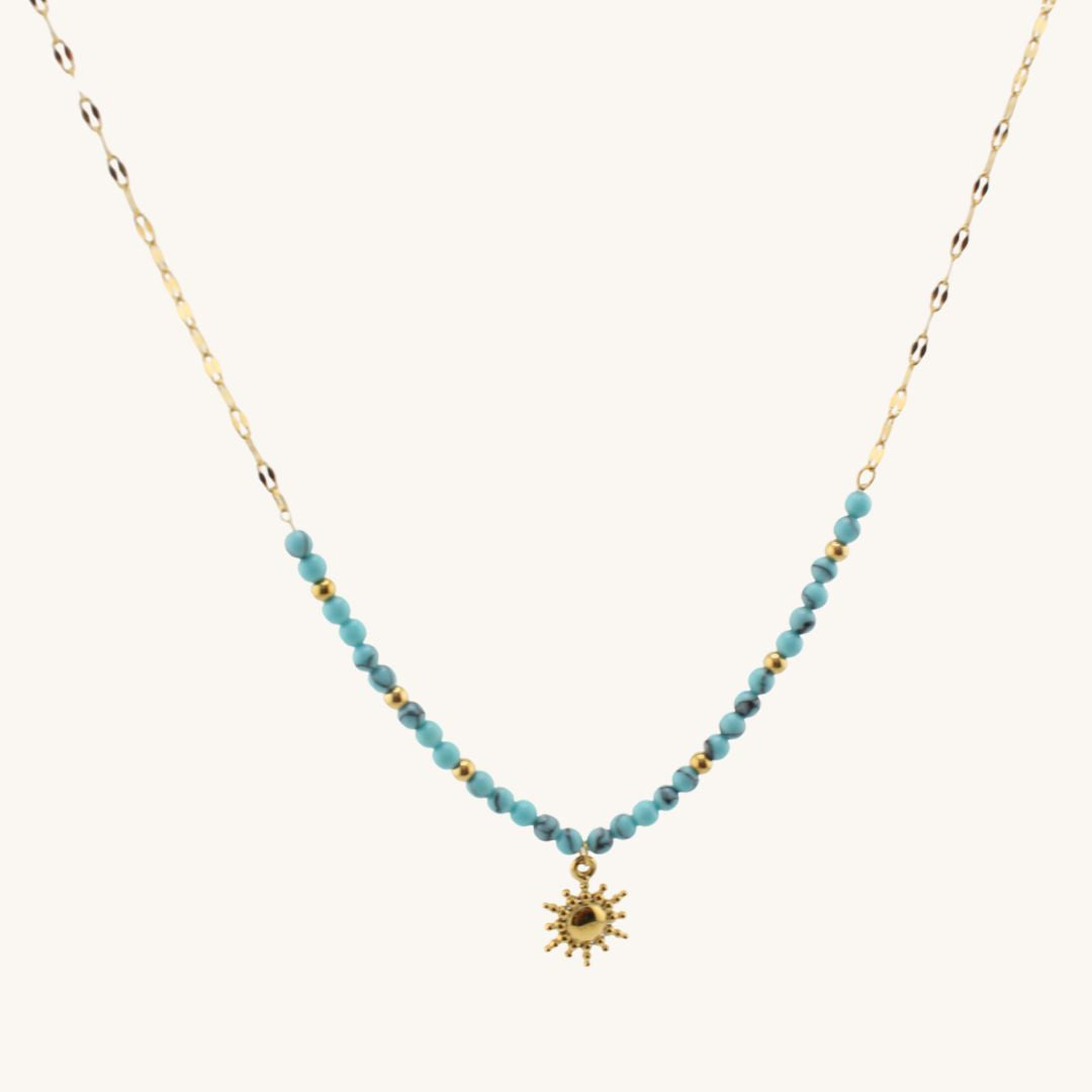 Collana dorata con perline turchesi e ciondolo sole piccolo