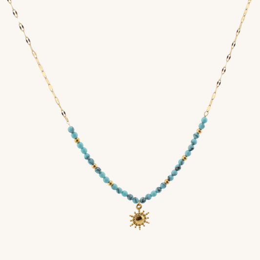 Collana con ciondolo sole in acciaio 316L placcato oro 18K e perle turchesi. Waterproof, anallergici ed eleganti.